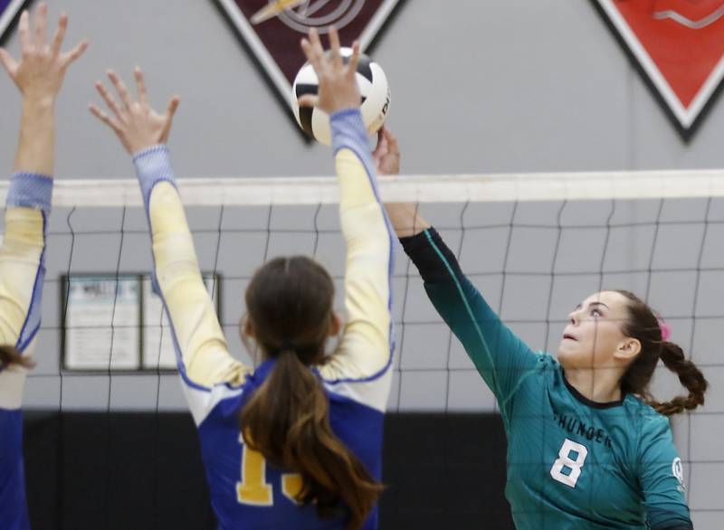 Woodstock North's Jayden Johnson (right) hits the ball past Johnsburg's Emerson Payne-Brennan during a Kishwaukee River Conference volleyball match on Wednesday, Sept. 4, 2024, at Woodstock North High School.