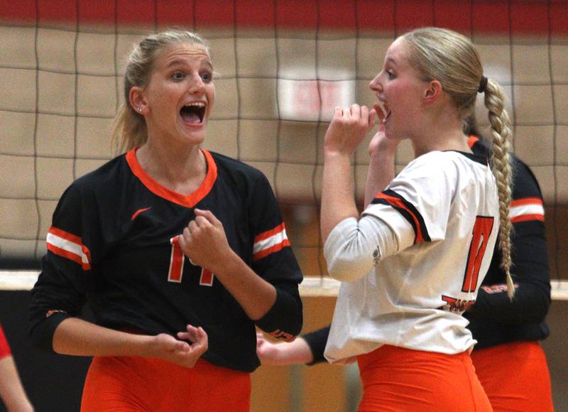 Crystal Lake Central’s Alexis Hadeler, left, and Tessa Popp celebrate a point during a Fox Valley Conference volleyball match on Tuesday, Aug. 27, 2024, at Huntley High School.