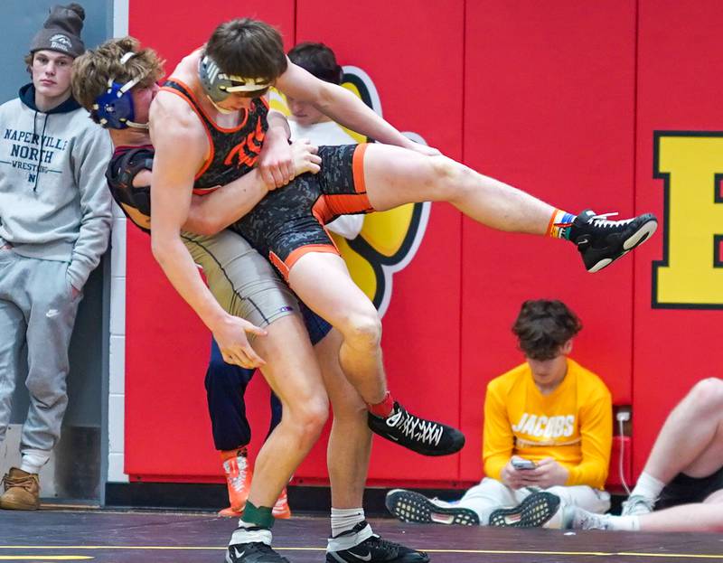 Marmion’s Vincenzo Testa lifts Washington’s Zane Hulet off the mat In a 175-pound third place match during The Clint Arlis Invitational Wrestling meet at Batavia High School in Batavia on Saturday, Jan 13, 2024.