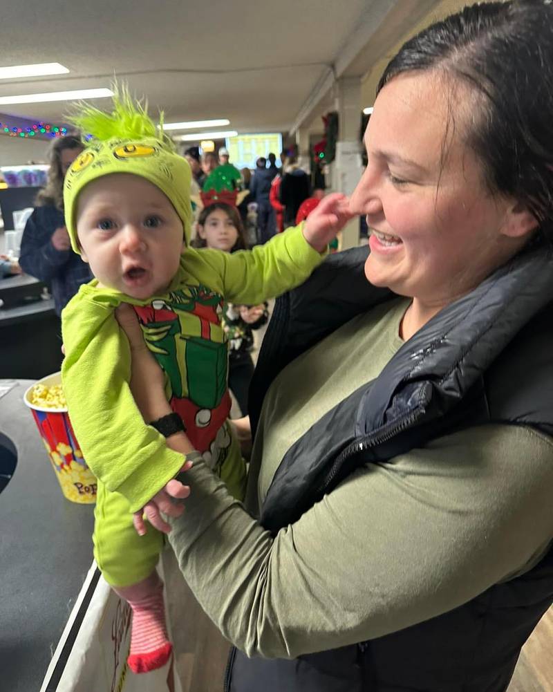 Sarah Manley and her daughter, Ella, enjoy a holiday movie during the McHenry Outdoor Theater's first extended season in late 2023. The theater will reopen March 22, weekends only until Memorial Day, after which it will be open seven days a week for the summer.