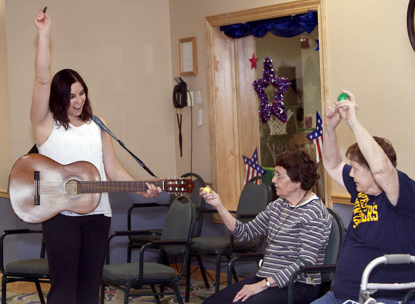 Stacy Jager music therapist sing along with Timbers of Shorewood residents Judy Kovic and Kathleen Stephens during the Music and Movement class at the at The Timbers of Shorewood retirement community Thursday, August 10, 2017, in Shorewood. The next class is Aug. 1.