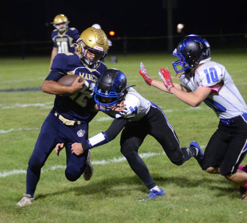 Polo's DeAngelo Fernandez (22) fights for yards against Blue Ridge during Friday, Oct. 6, 2023 action at Polo High School.