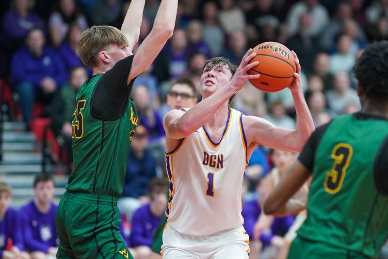 Downers Grove North's Alex Miller (25) plays the ball in the post against Waubonsie Valley's Case Valek (25) during a Class 4A East Aurora sectional semifinal basketball game at East Aurora High School on Wednesday, Feb 28, 2024.