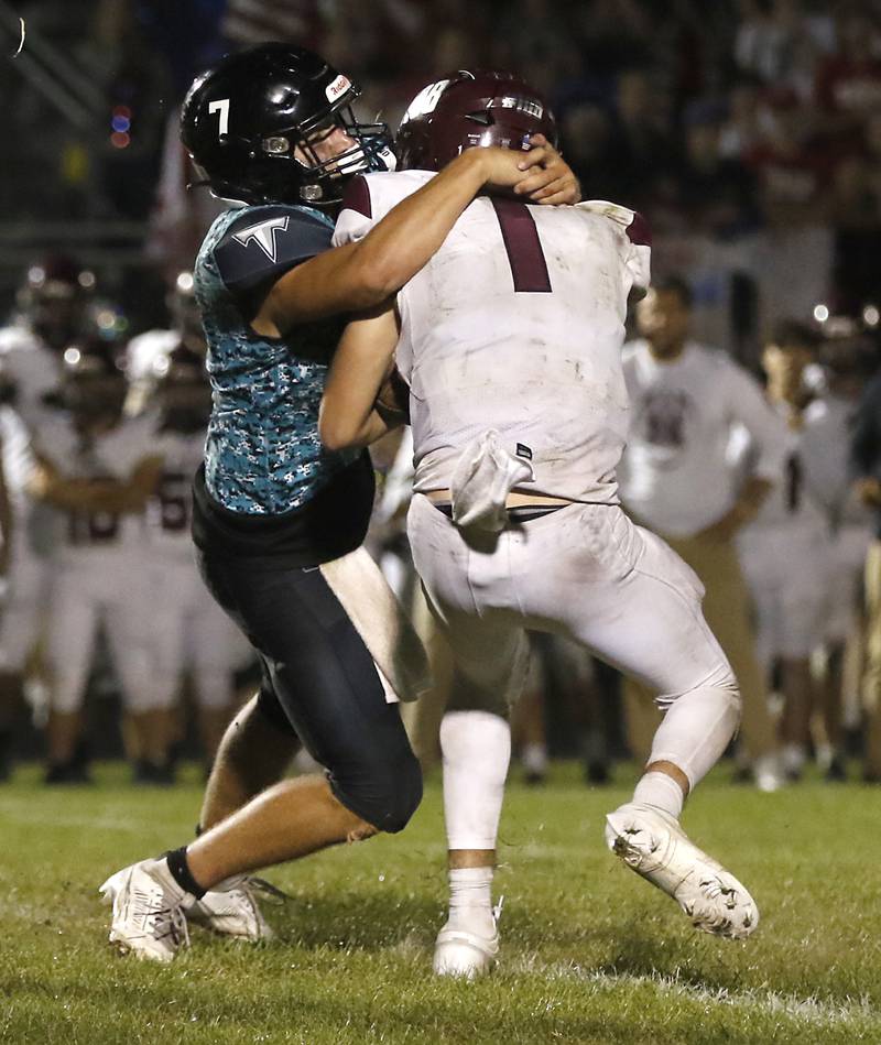 Woodstock North's Parker Halihan sacks Marengo's David Lopez during a Kishwaukee River Conference football game on Friday, Sept. 13, 2024, at Woodstock North High School.