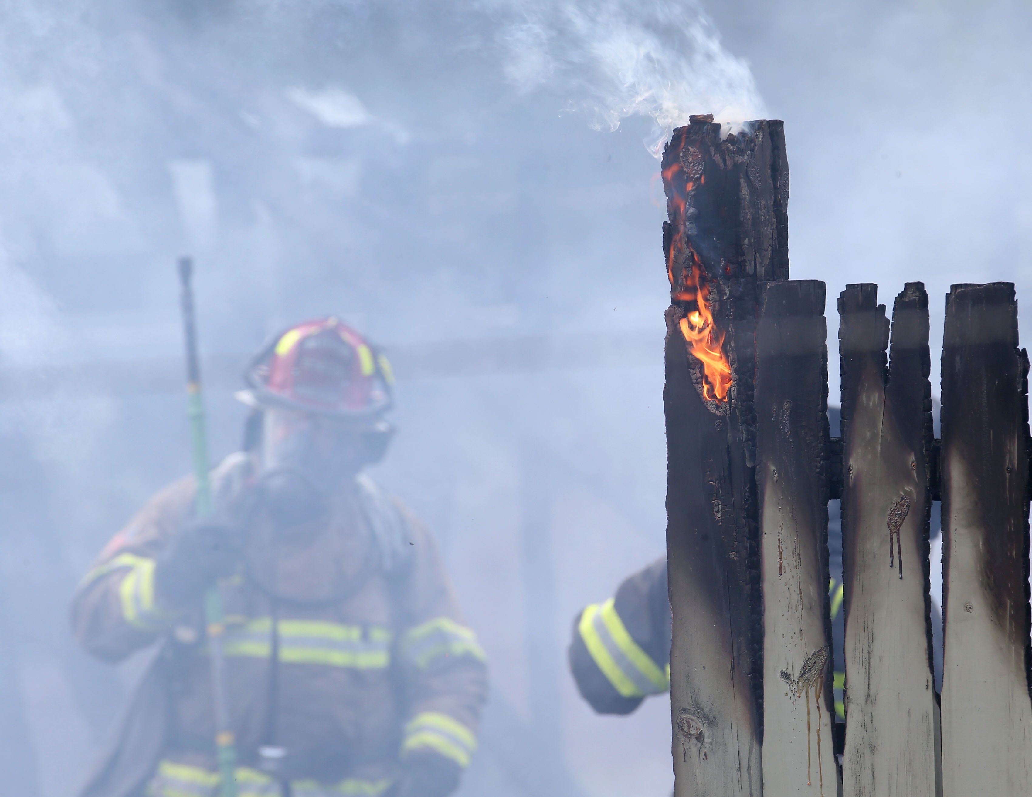 La Salle firefighters extinguish flames from a garage fire in the 800 block of Lafayette Street on Monday, July 22, 2024. The fire began just before 1p.m. La Salle Fire and EMS along with Peru Fire department responded to the call while La Salle Police directed traffic.