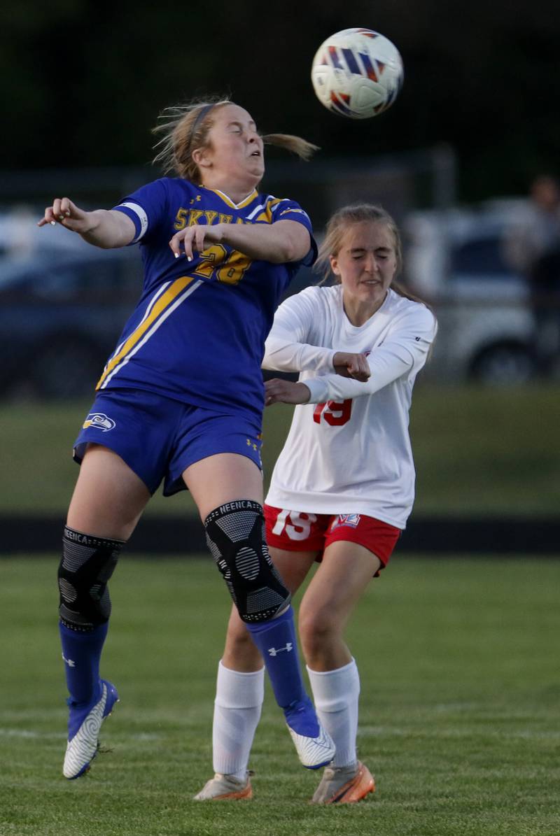 Johnsburg's Mackenzie McQuiston heads the ball towards the goal in front of Marian Central'a Zeda Deaver during the IHSA Class 1A Marengo Regional championship soccer match on Tuesday, May 14, 2024, at Marengo High School.