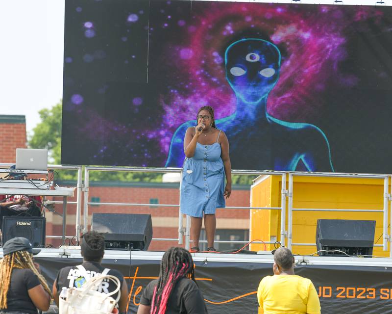 Shakeira Galloway of DeKalb recites a poem as her friends, family and other community members in attendance listen at the 3rd annual Juneteenth celebration held in Plano at Emily G. Johns School on Saturday June 17, 2023.