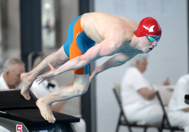 Hinsdale Central’s Noah Priest takes off the blocks for the championship heat of the 100-yard freestyle during the IHSA Boys State Championships at FMC Natatorium in Westmont on Saturday, Feb. 25, 2023.