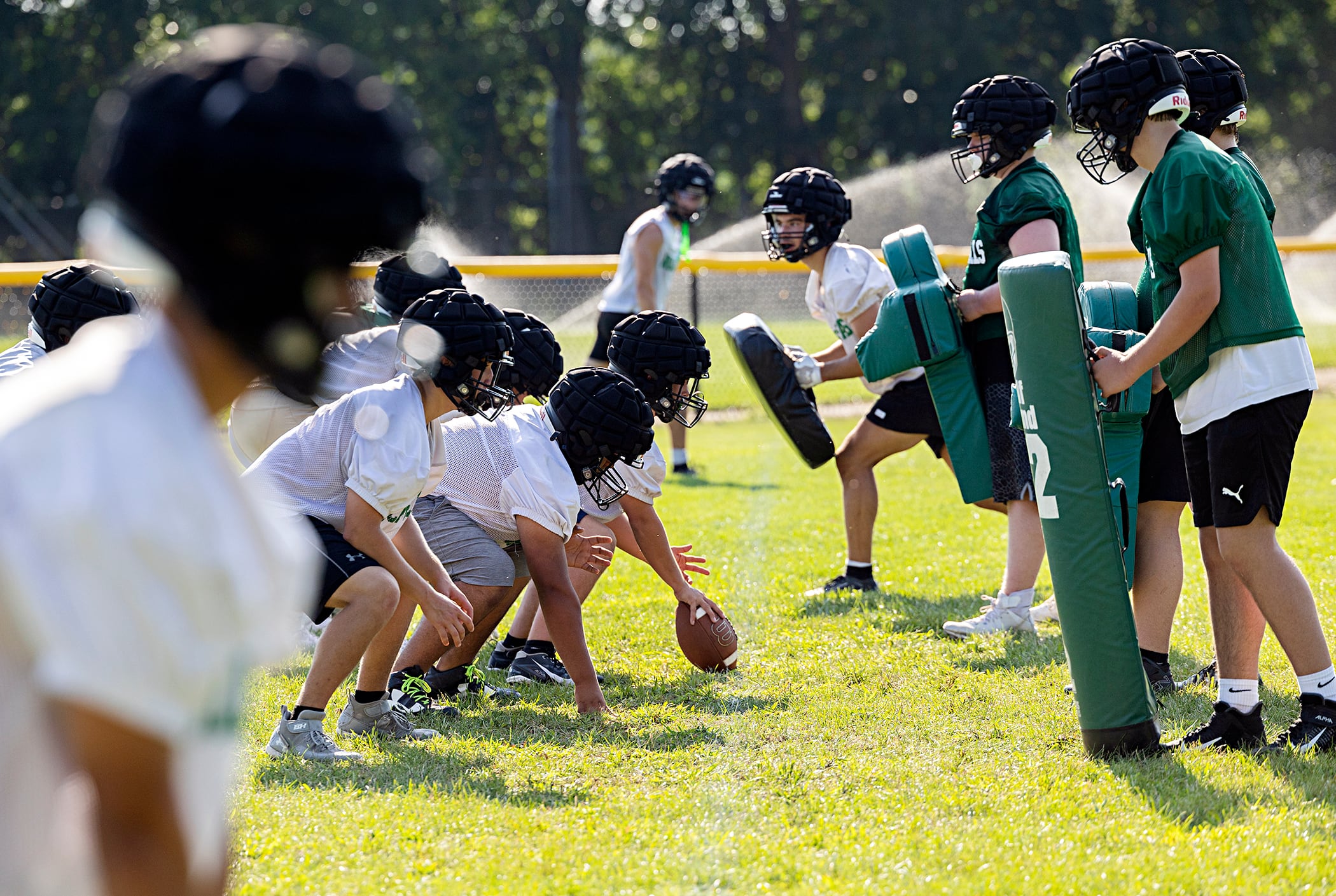 The Rock Falls football team line up for drills Tuesday, Aug. 13, 2024. The Rockets face Byron on Aug. 30.