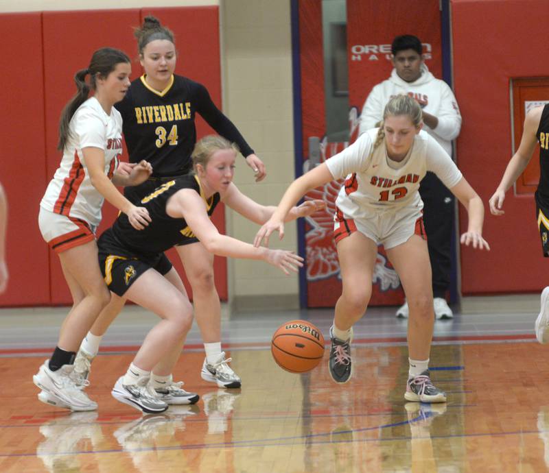 Riverdale's Alexis Duke (00) and Stillman Valley's Mya Janssen (13) chase after a loose ball on Tuesday. Feb. 20, 2024 at the 2A Oregon Sectional held at the Blackhawk Center at Oregon High School. The Rams' season ended with a 57-34 loss to the Cardinals.