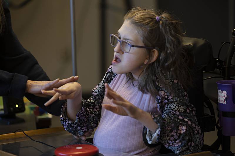 Addy Weidman, an eighth grader at Reagan Middle School, work with a Big Mac Switch to control a smart board Thursday, April 6, 2023 at the school. Weidman uses a variety of technology in her learning.