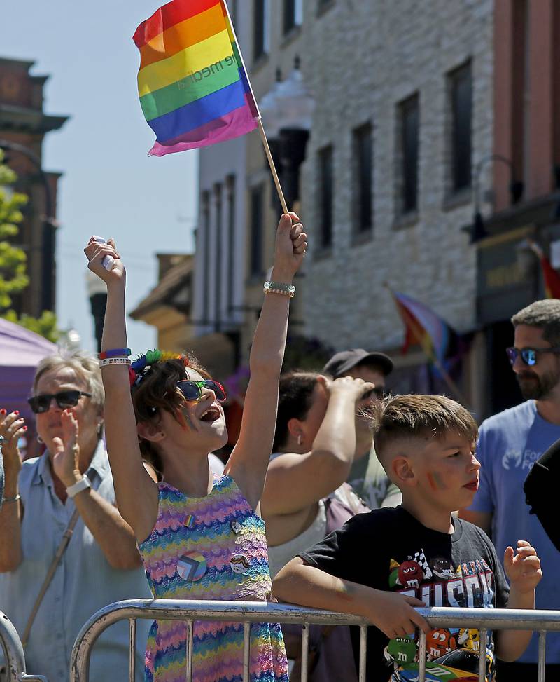 Stella Panico waves her pride flag during the Woodstock PrideFest Parade on Sunday, June 9, 2024, around the historic Woodstock Square.