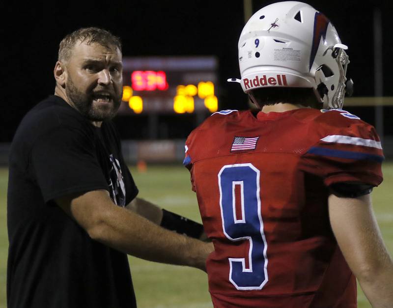 Dundee-Crown Head Coach Michael Steinhaus yells at quarterback Hayden DeMarsh during a Fox Valley Conference football game against Crystal Lake South on Friday, Aug 30, 2024, at Dundee-Crown High School in Carpentersville.