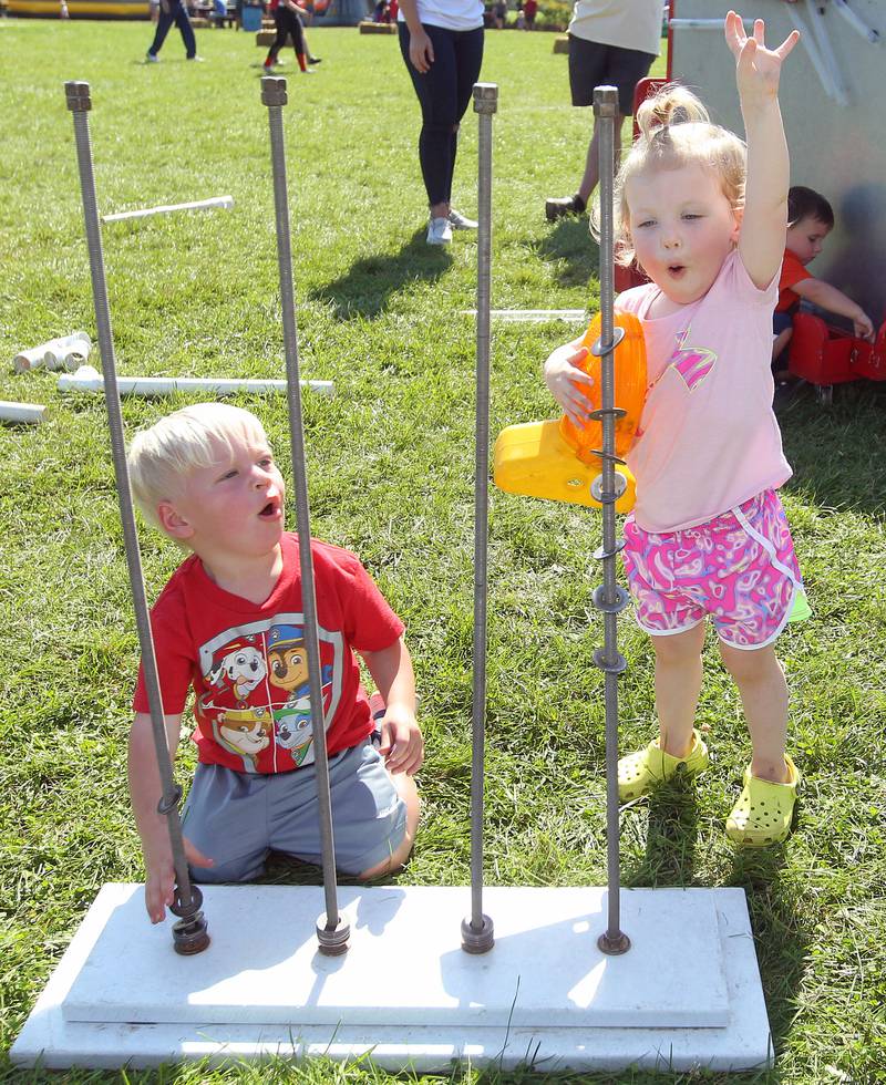 Braxton Lessner, eighteen-months-old, of Round Lake and his cousin, Harlow Ziebell, 2, of Volo play with a Busy Brains Children's Museum interactive exhibit during the Fall Festival at Grant Township Center on October 1st in Ingleside. The event was sponsored by the Village of Fox Lake and Grant Township.
Photo by Candace H. Johnson for Shaw Local News Network