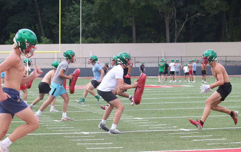 Members of the L-P Cavalier football run drills during  the first day of practice on Monday, Aug. 12, 2024 at Howard Fellows Stadium.