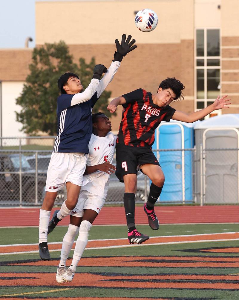 DeKalb's Joaquin Medina-Benitez tries to win a ball against Rockford East’s goal keeper during their game Thursday, Sept. 12, 2024, at DeKalb High School.