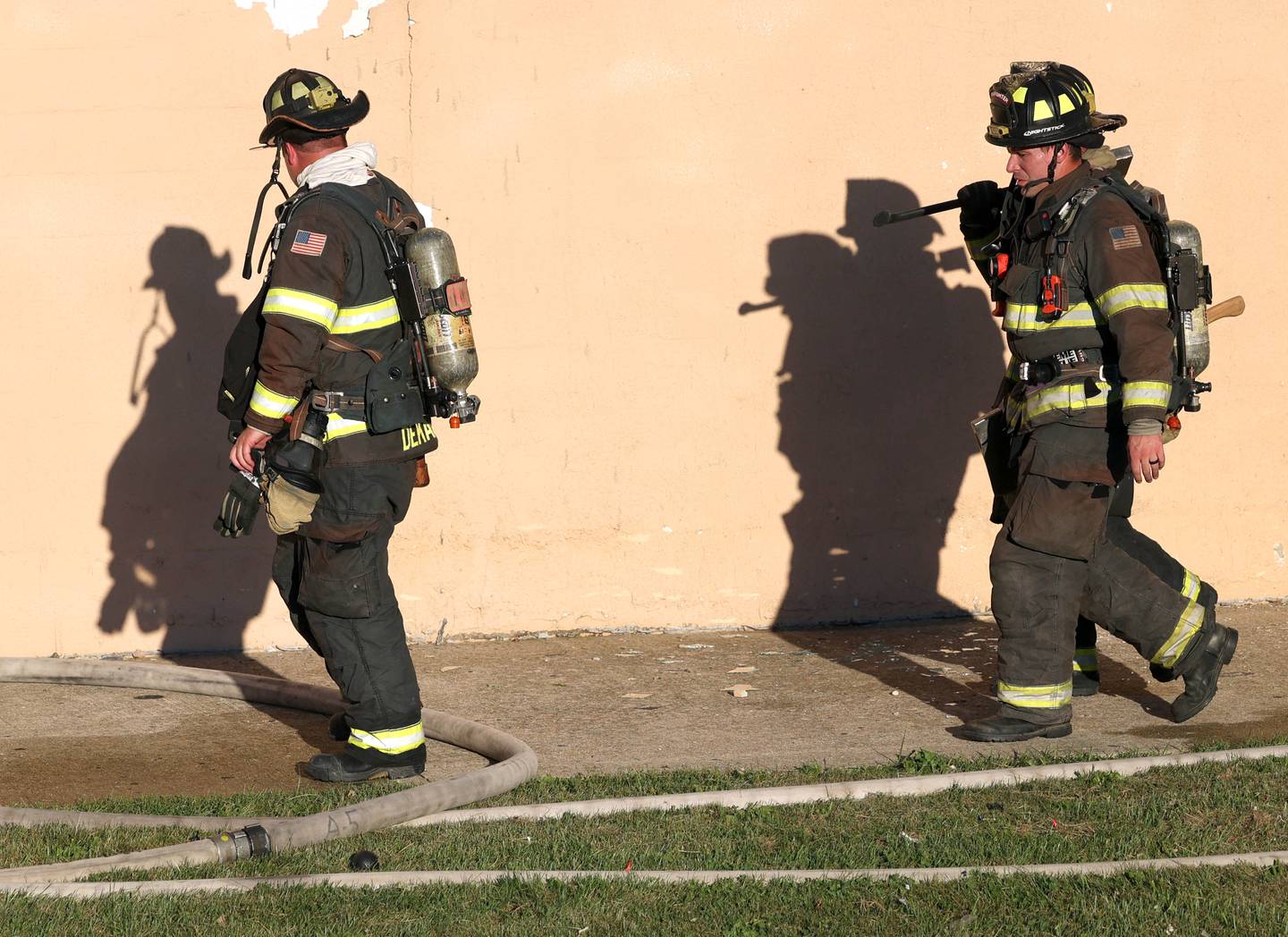 DeKalb firefighters exit a building after battling a structure fire Friday, Sept. 1, 2023, in the building that once housed Fanatico Italian restaurant at 1215 Blackhawk Road in DeKalb.