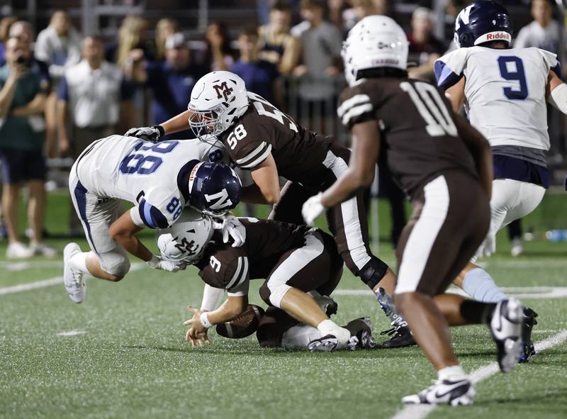 Nazareth's Christopher Kasky (88) goes after a muffed snap live ball during the varsity football game between Nazareth Academy and Mt. Carmel high school on Friday, Sep. 13, 2024 in Chicago.