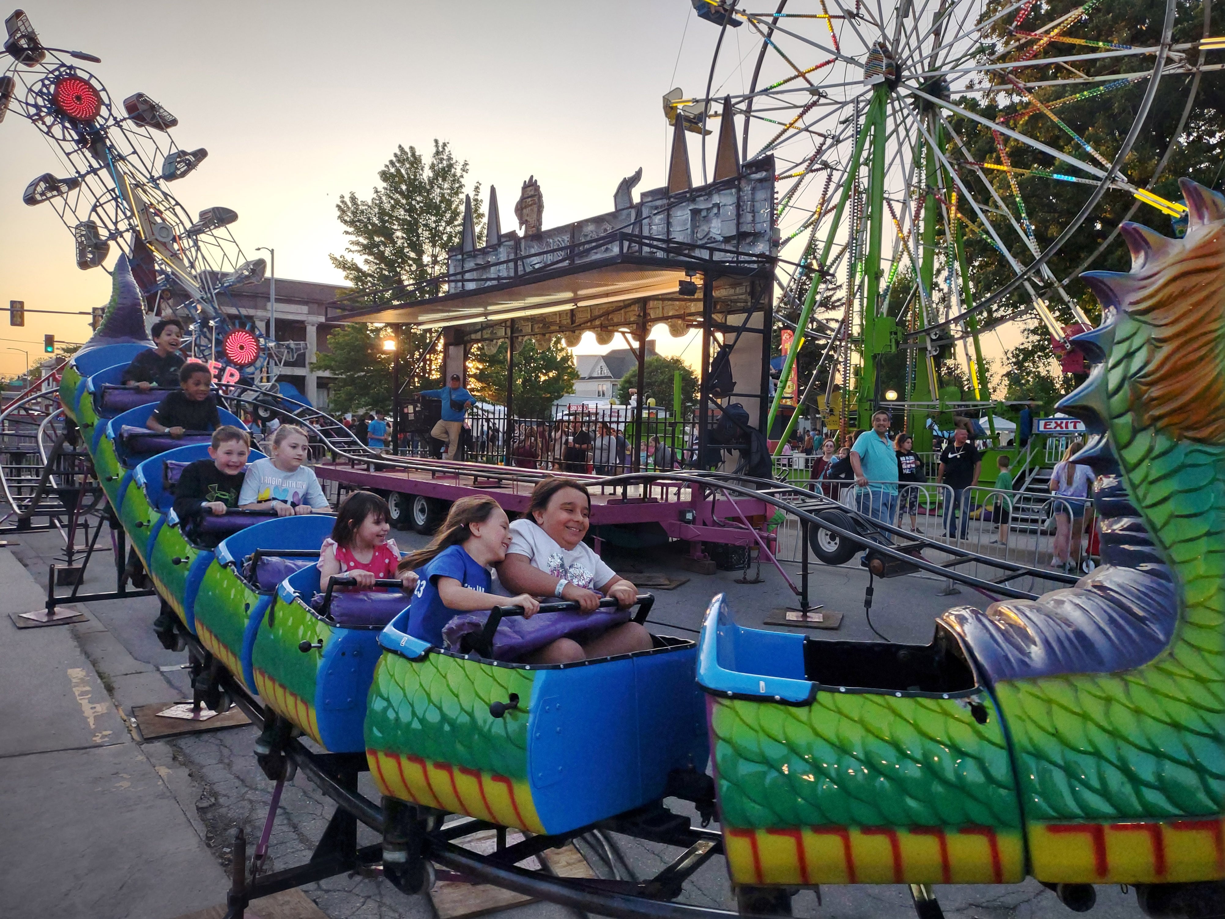 Children zoom along the track of the Dragon Wagon at Streator Park Fest on Friday, May 26, 2023.