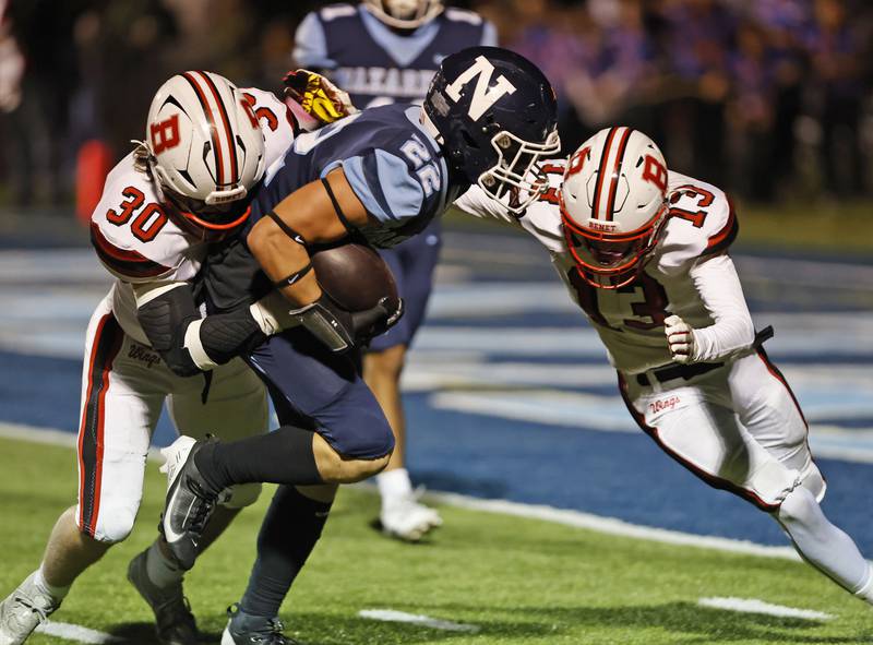 Nazareth's Anthony Donato (22) runs the ball during the varsity football game between Benet and Nazareth academies on Friday, Oct. 18, 2024 in La Grange Park.