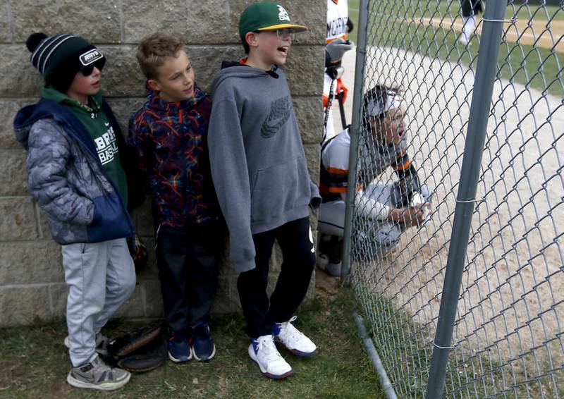 Young baseball fans cheer along with McHenry catcher Cooper Cohn as the watch the a Fox Valley Conference baseball game Friday, April 15, 2022, between Jacobs and McHenry at Petersen Park in McHenry.