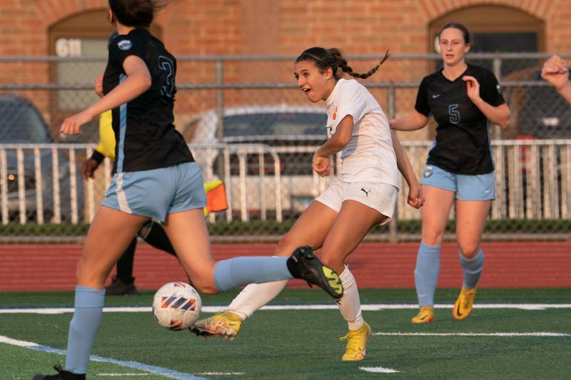 Wheaton Warrenville South's Lucy Jethani (5) shoots the ball against St. Charles North during the Class 3A girls soccer regional final at St. Charles North High School on Friday, May 19, 2023.