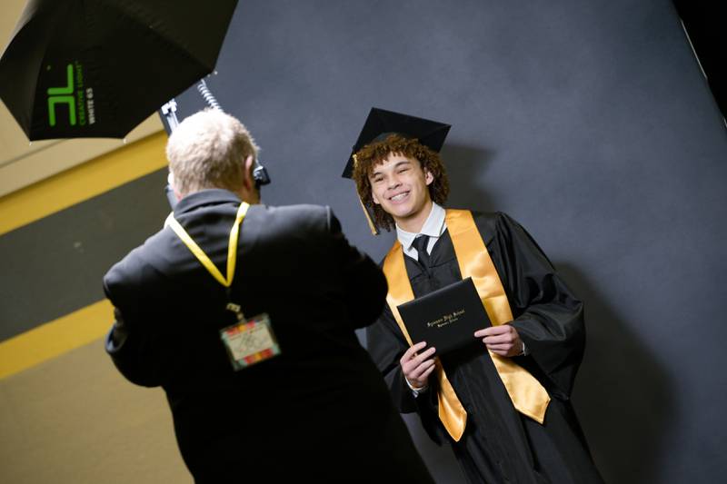 Jerome Greene has his photo take after receiving his diploma during the 2024 Sycamore High School commencement in Sycamore on Sunday, May 26, 2024.