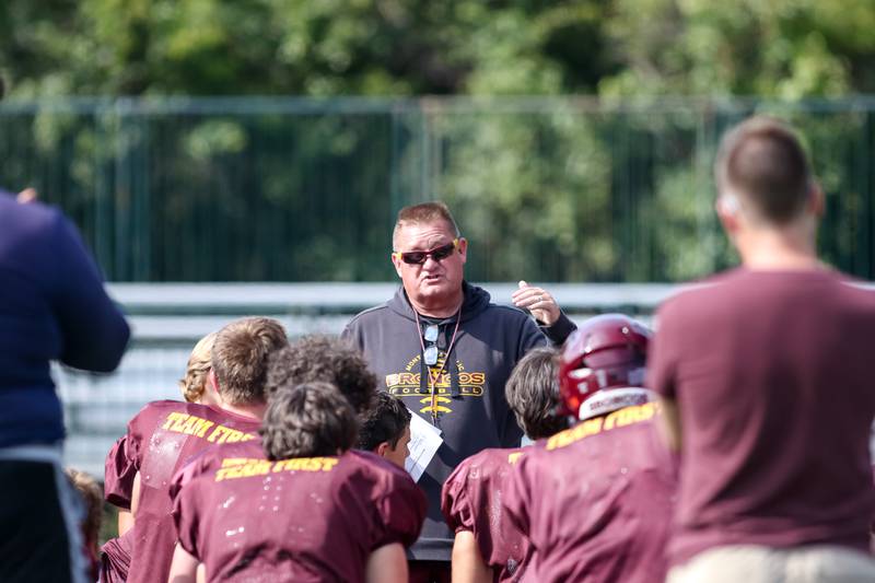 Montini head coach Mike Bukovsky addresses the team before the start of football practice. Aug 22 2024.