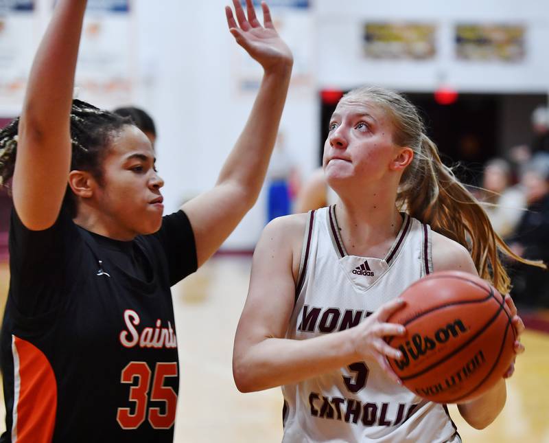 Montini's Victoria Matulevicius goes to the basket as St. Charles East's Corinne Reed (35) defends during the Montini Christmas Tournament championship game on Dec. 29, 2023 at Montini Catholic High School in Lombard.