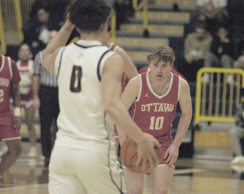 Ottawa's Evan Snook watches the eyes of Sterling's Andre Klaver  during Sterling’s 3A Regional semifinal game Wednesday, Feb. 21, 2024, at Sterling High School.