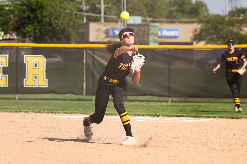 Joliet West’s Ella Featherston throws to first against Plainfield Central on Wednesday, May 15, 2024 in Joliet.