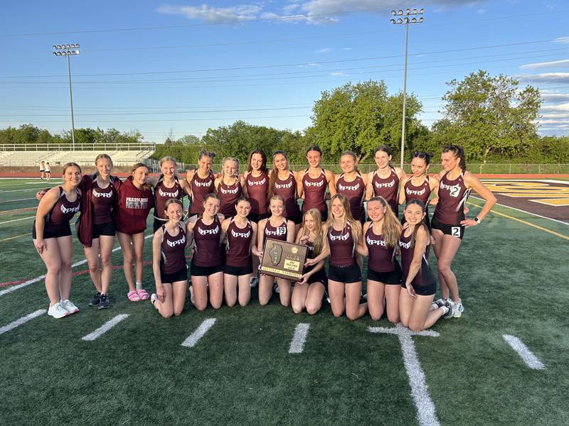 Prairie Ridge poses with its plaque after winning the Class 2A Carmel Sectional in Mundelein on Wednesday.