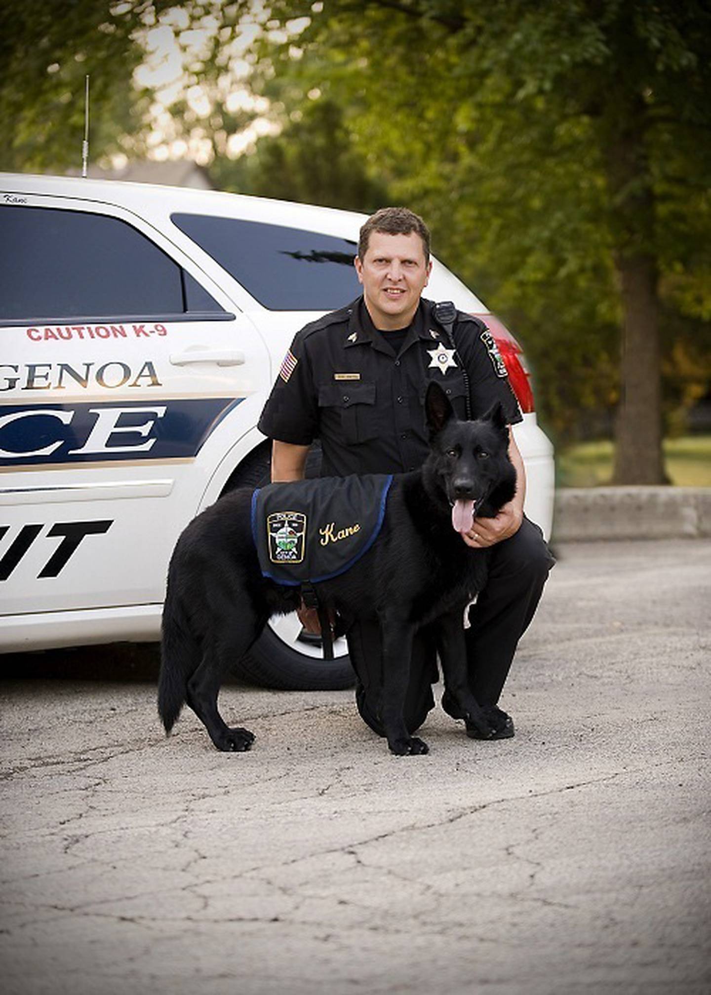 Shaw Local July 2012 file photo – Genoa Police Chief Robert Smith with his K-9 partner, Kane.