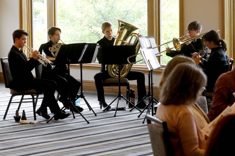 Members of the Elgin Youth Symphony Orchestra’s Sterling Brass Quintet, perform during the Northwest Herald's Women of Distinction award luncheon Wednesday June 5, 2024, at Boulder Ridge Country Club, in Lake in the Hills. The luncheon recognized 11 women in the community as Women of Distinction.