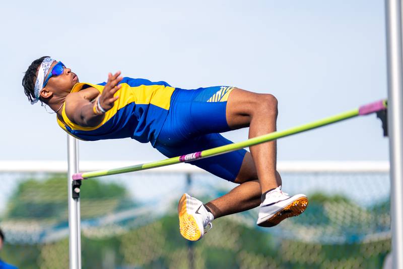 Wheaton Nortth’s Jonpaul Brown competes in the high jump during a DuKane Conference boys track and field meet at Geneva High School on Thursday, May 11, 2023.