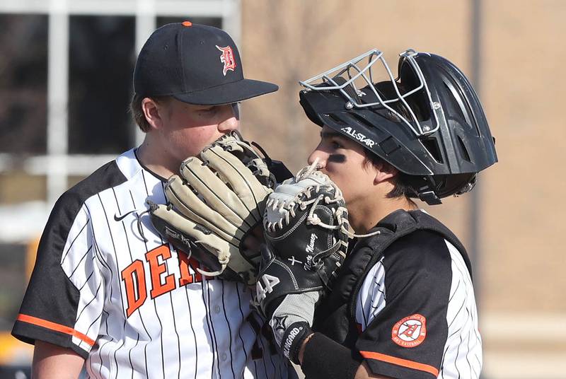 DeKalb catcher Nate Nunez comes out to talk to pitcher Brodie Farrell during their game against Metea Valley Thursday, April 13, 2023, at DeKalb High School.