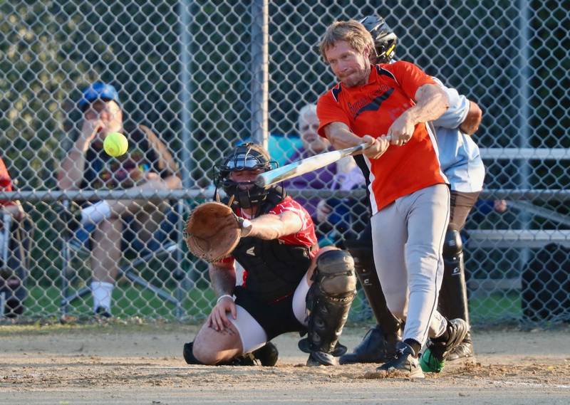 People Church's Jeremy House hammers a pitch in Friday's Princeton Park District Fastpich League tournament play at Westside Park.