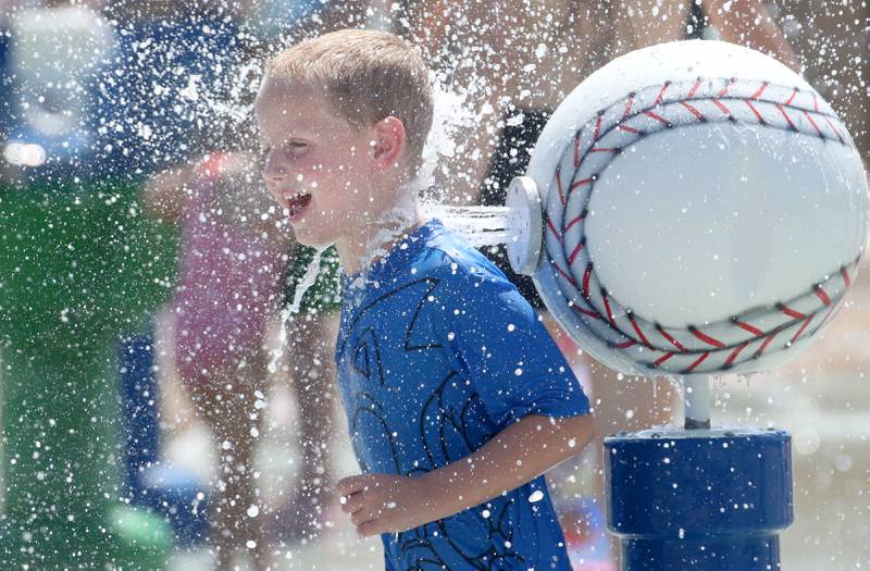 Beckett Suggett of La Salle cools off at the Splash Field at Washington Park on Monday, June 17, 2024 in Peru.