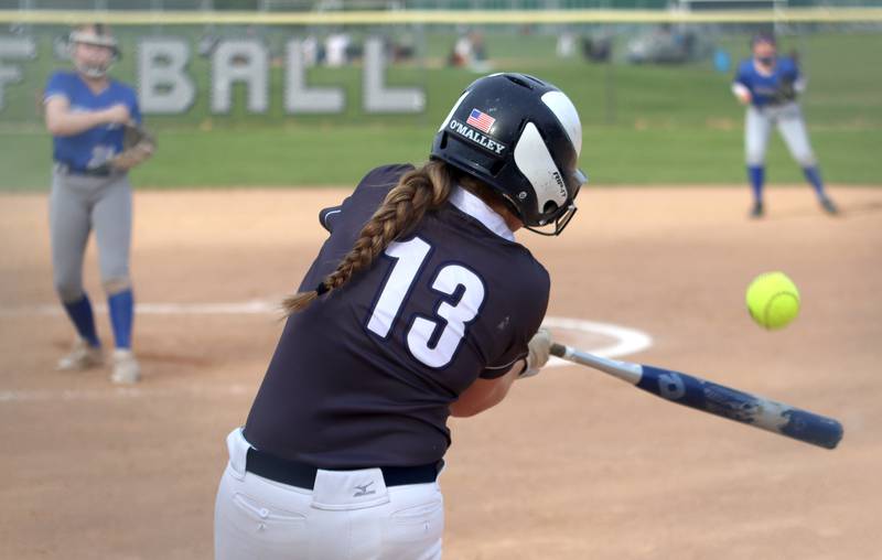 Cary-Grove’s Katelyn O’Malley makes contact against Burlington Central in varsity softball at Cary Monday.