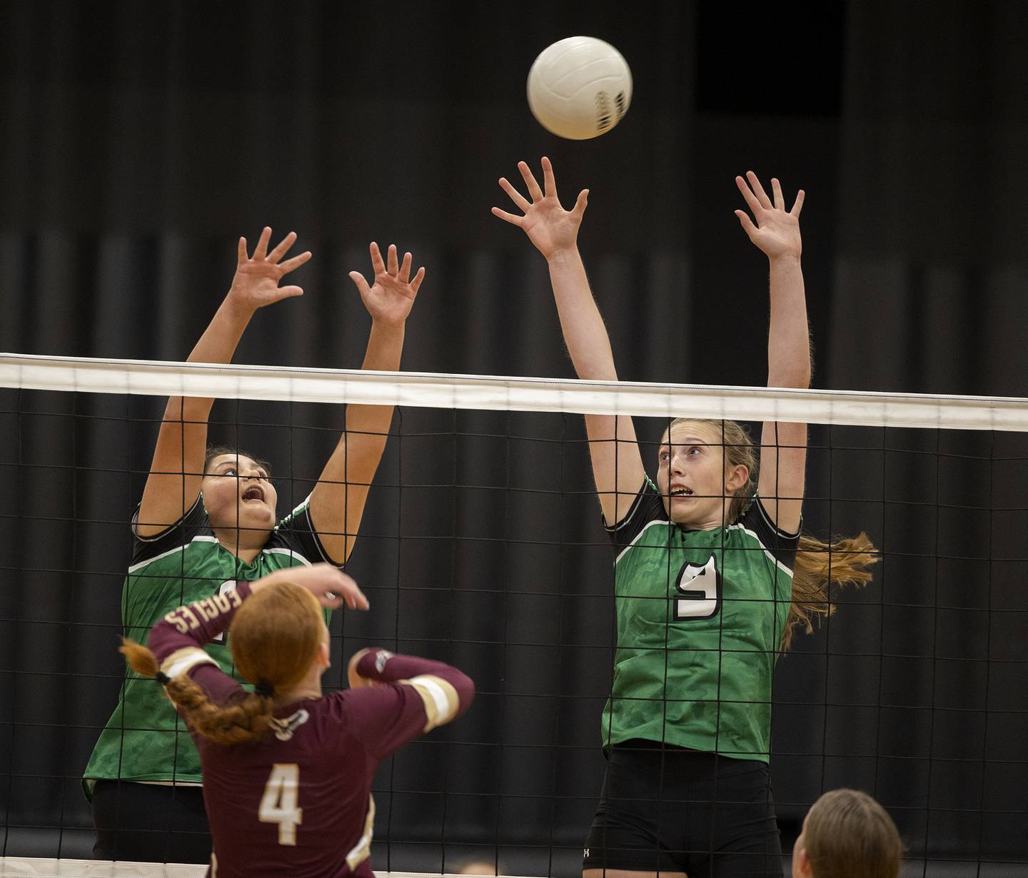 Rock Falls’ Ari Reyna (left) and Kayla Hackbarth work the net against Dunlap’s Tessa Arnott Thursday, Aug. 29, 2024, at Rock Falls High School.