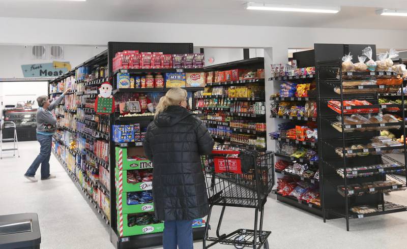 Shoppers search for groceries at the Royal Super Mart on Monday, Dec. 18, 2023 in Sheffield. The community raised over a half-million dollars to keep the store open under new ownership.