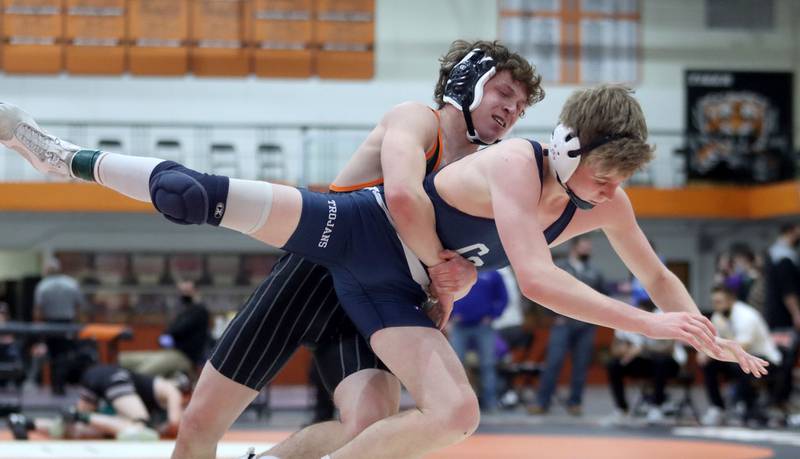 Cary-Grove’s Rannin Gruen, front, battles Crystal Lake Central’s Brent Campagna in a 126-pound bout during IHSA Class 2A regional wrestling at Crystal Lake Central Saturday. Gruen won the bout.