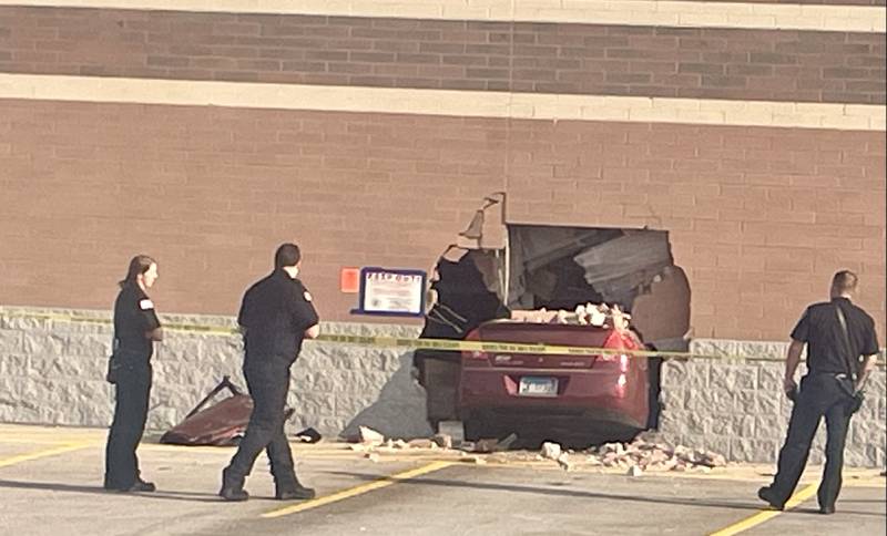 A car crashed into the Walmart Supercenter in Algonquin on Sept. 11, 2024, injuring the driver and damaging the building. About eight hours later, at about 8:30 a.m., the car had not yet been removed.