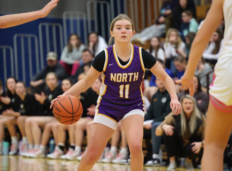 Downers Grove North’s Abby Gross (11) drives to the basket against Lyons Township during the girls varsity basketball game on Tuesday, Jan. 16, 2024 in La Grange, IL.