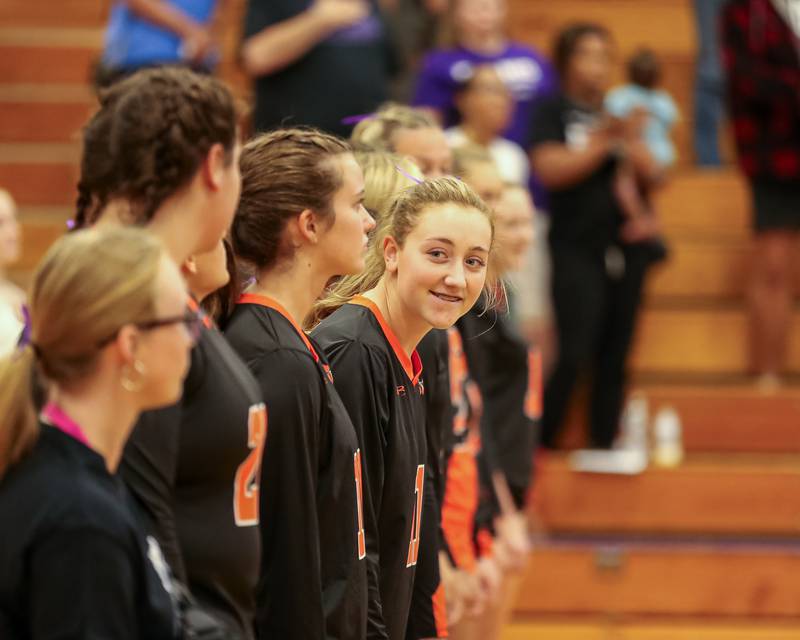 The Sandwich team stands during the playing of the National Anthem before their volleyball match at Plano.  August 21, 2023.