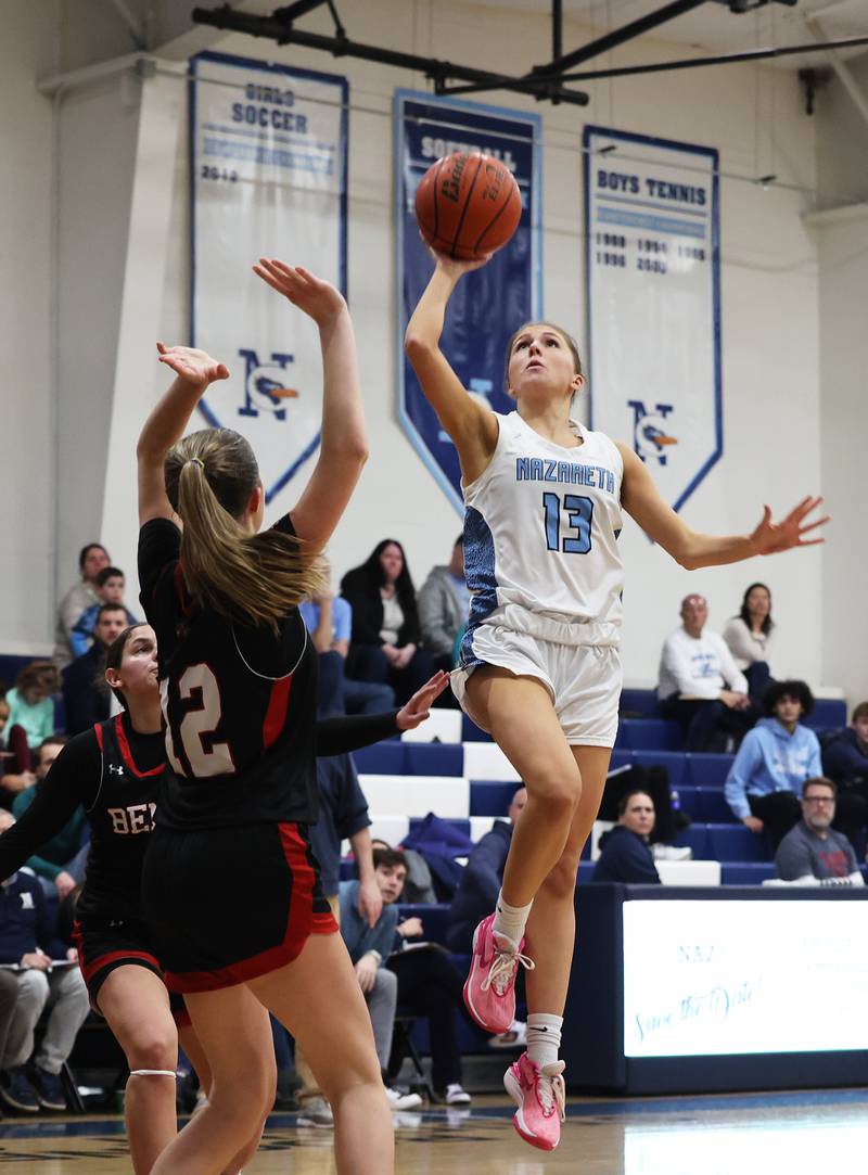 Nazareth’s June Foley (13) puts up a shot against Benet during a girls varsity basketball game on Monday, Jan. 29, 2024 in La Grange Park, IL.