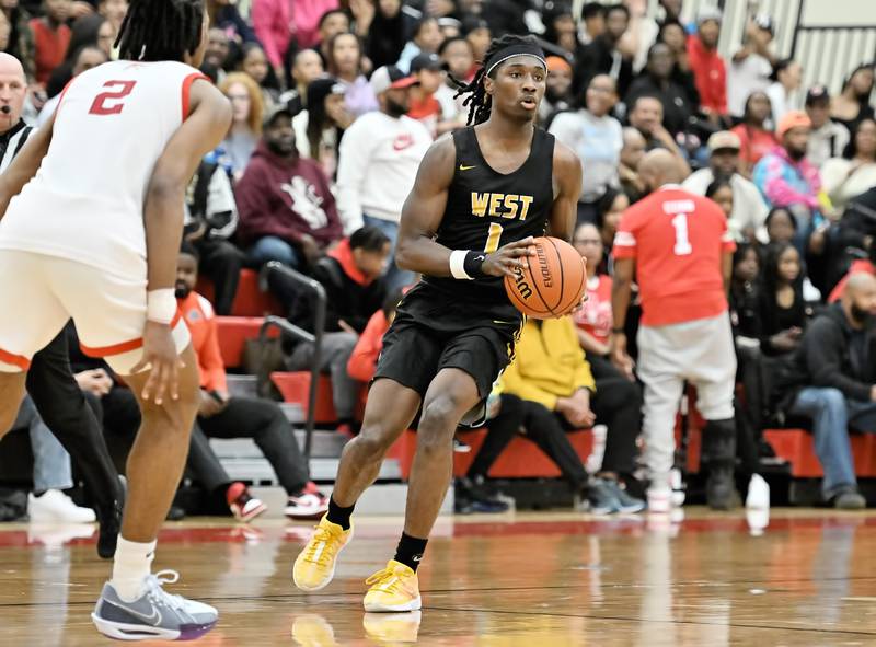 Joliet West's Justus Mcnair looks to pass the ball during the Class 4A sectional semifinal against Homewood Flossmoor at Rich Township on Tuesday, Feb. 27, 2024, at Richton Park. (Dean Reid for Shaw Local News Network)
