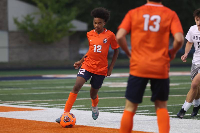 Romeoville’s Kameron Mcshaw works the ball midfield against Joliet West on Wednesday, Oct. 11, 2023 in Romeoville.