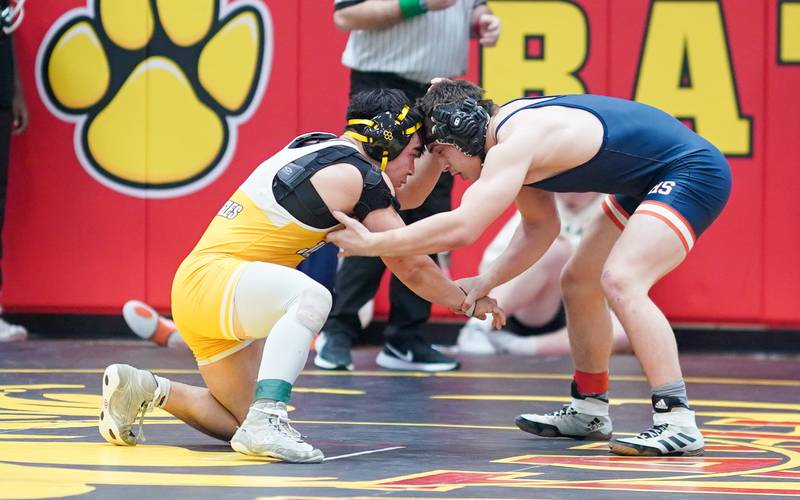 Naperville North’s Matas Budreika (right) circles the Matt against Jacobs’ Daniel Mendez In a 165-pound third place match during The Clint Arlis Invitational Wrestling meet at Batavia High School in Batavia on Saturday, Jan 13, 2024.