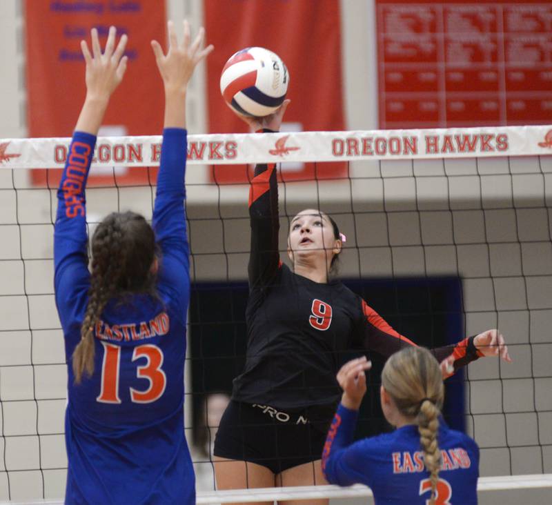 Erie-Prophetstown's Ashlyn Johnson (9) taps the ball away from Eastland's Vannesa Allen (13) and Shelby Groezinger (3) during a match at the Oregon Volleyball Tournament  on Saturday, Sept. 7, 2024.